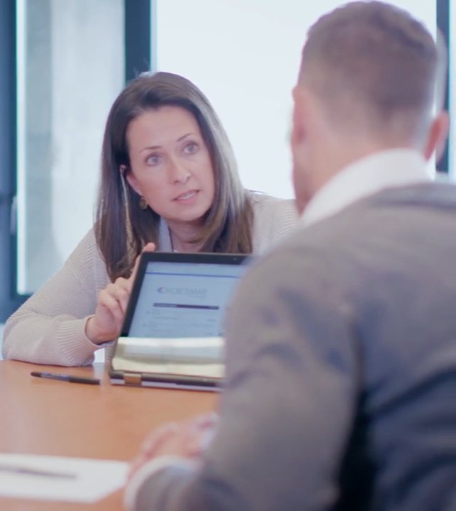 Rebecca Alleyne walking a client through calculations on screen during mediation